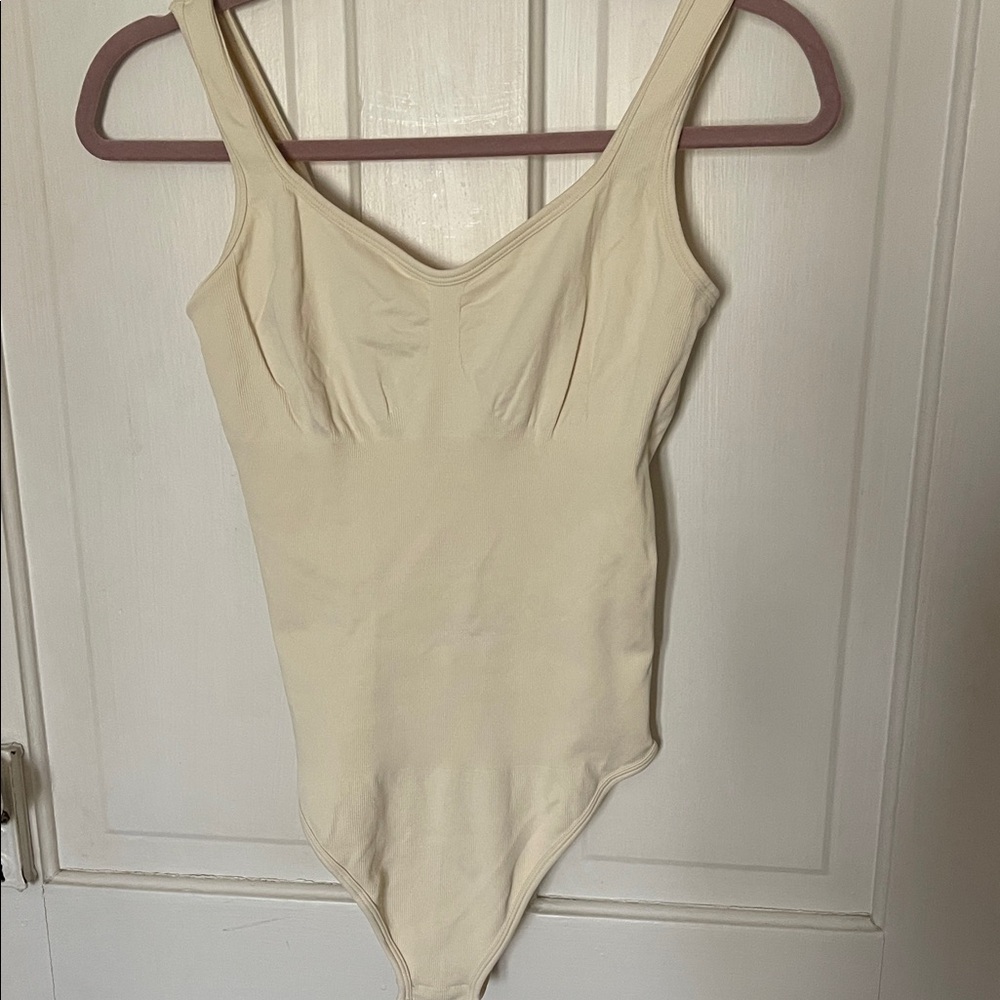 Seamless Shaping Bodysuit in Cream — Sculpting Support